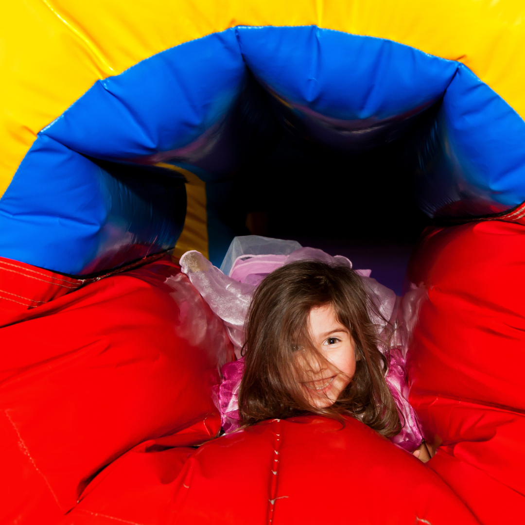 Colorful bounce house combo with slides set up for a children's birthday party in Valdosta, Georgia